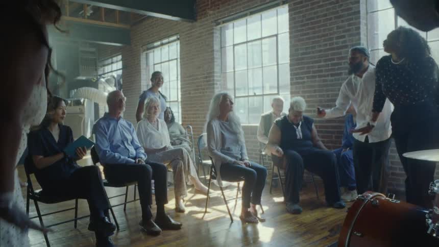 People are performing music for a group