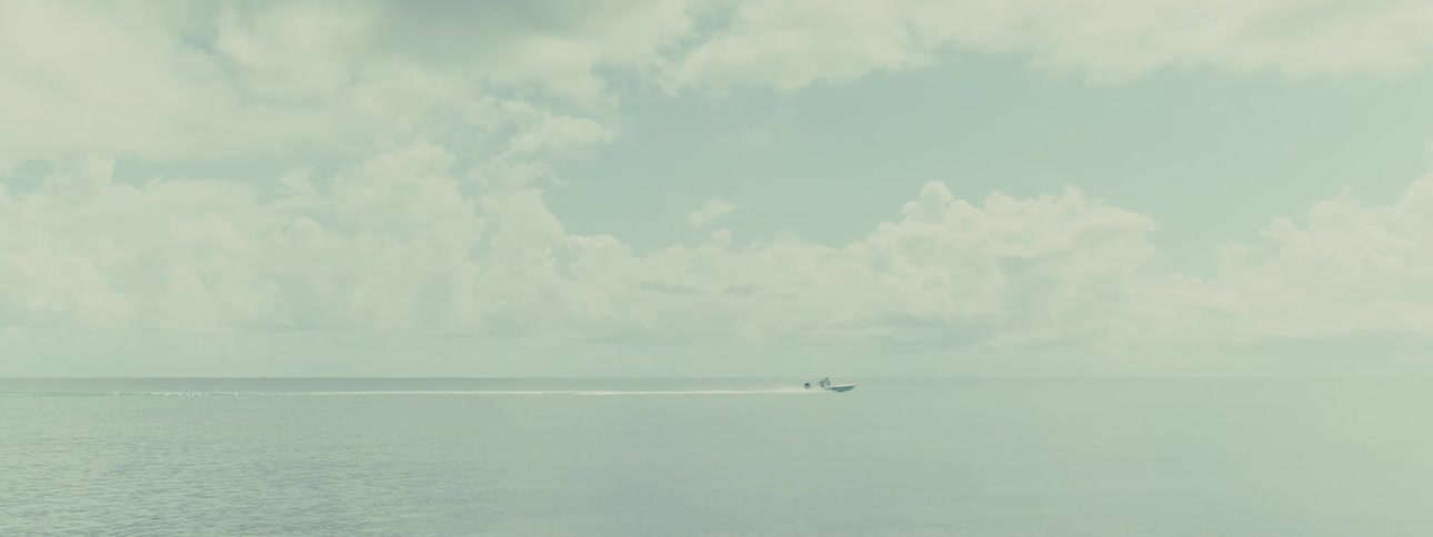Speed boat moving on the ocean during the day