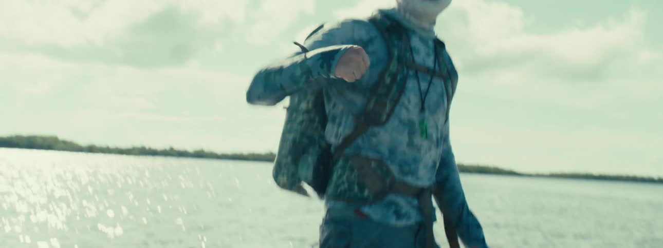 Men on a beach celebrating a catch