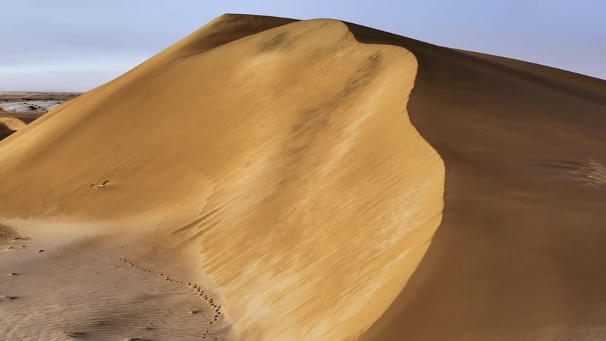 Aerial of dune in desert during hot day