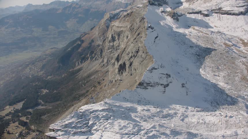 The mountain range is covered with ice and snow