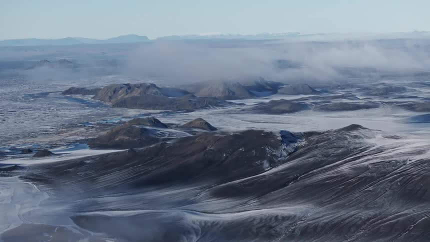 Aerial panorama of snowcovered mountains and plateaus
