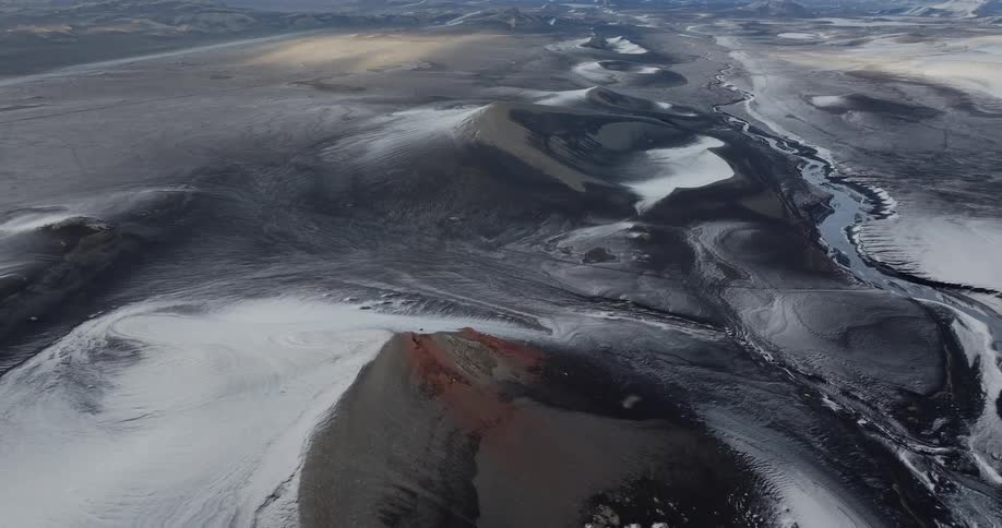 A little bit of snow on dunes near a river