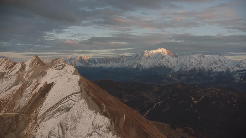 The tips of the mountains are covered with snow