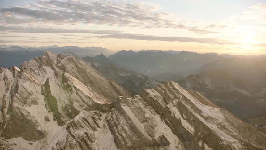 Aerial of a rocky mountain peak at dawn