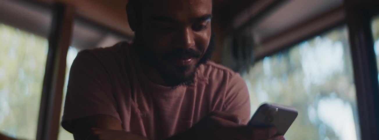 A man is using his cell phone