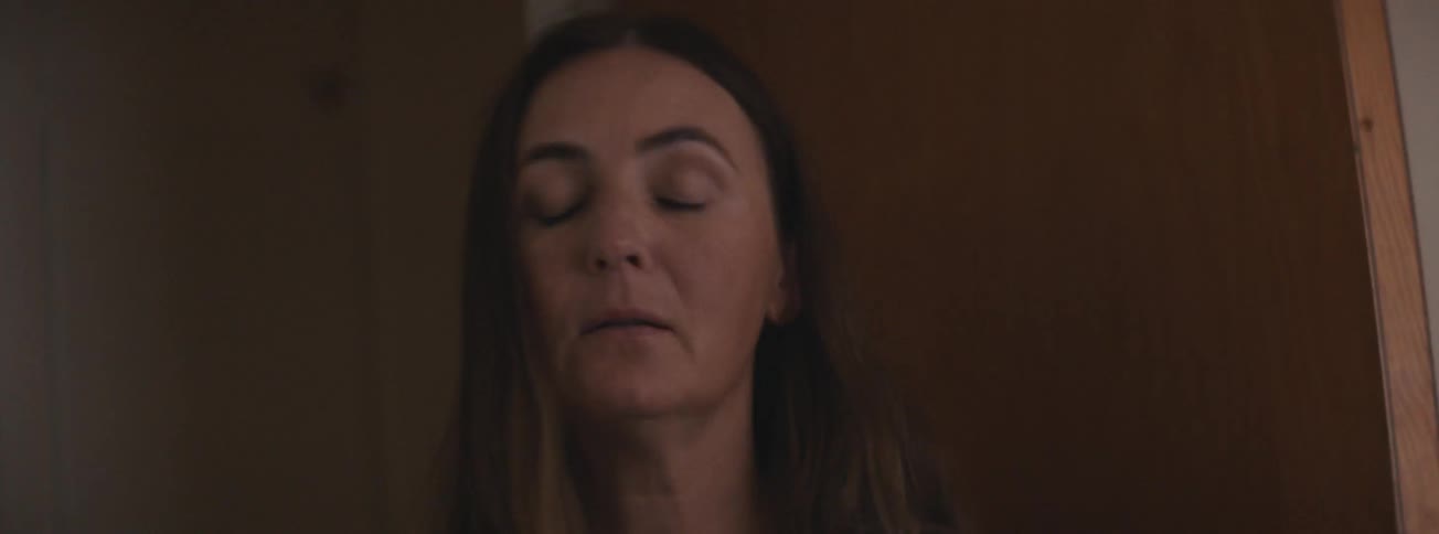 Portrait of a woman talking to someone and with a slight expression of irritation