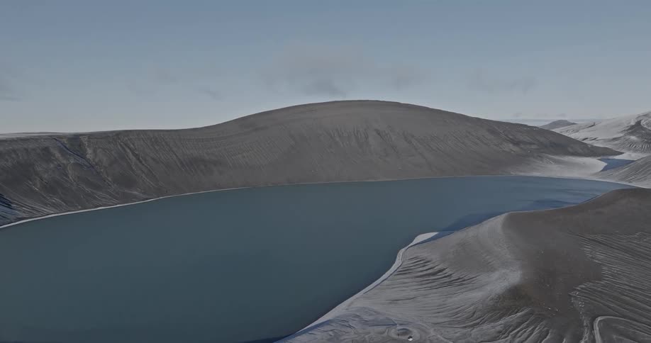A huge lake between sand hills