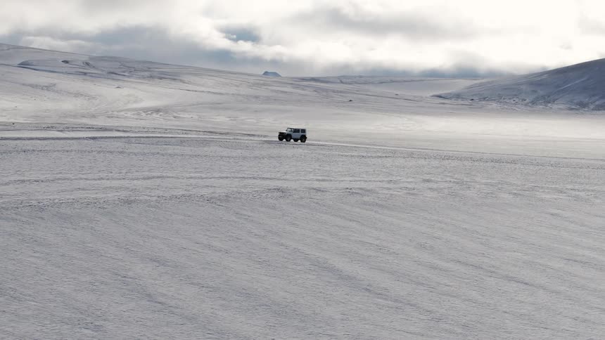 Jeep driving on snow