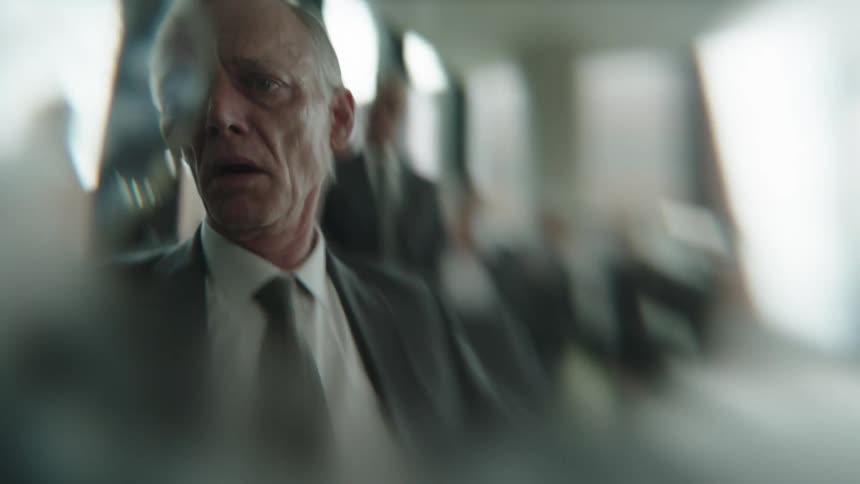 Portrait of an elderly man in a suit with a facial expression of distress