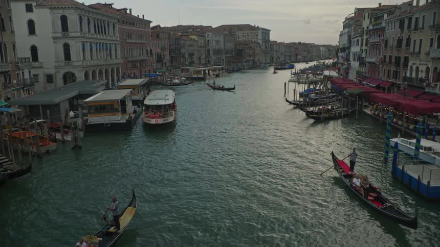 The boats are traveling down the canal