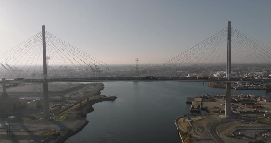 Skyline of a suspension bridge over the citys port area
