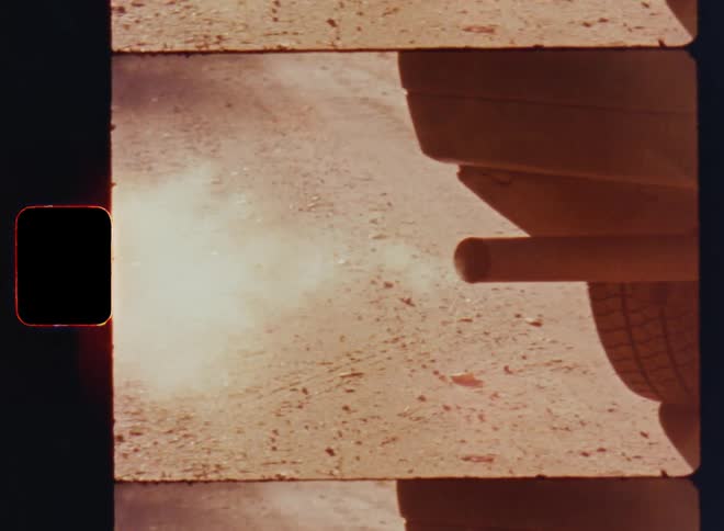 Dirty smoke and waste or exhaust gas coming from the cars exhaust pipe or tailpipe while starting the motor of an old vehicle or white automobile with diesel or petrol engine causing harmful emissions and global warming on retro vintage S8 film