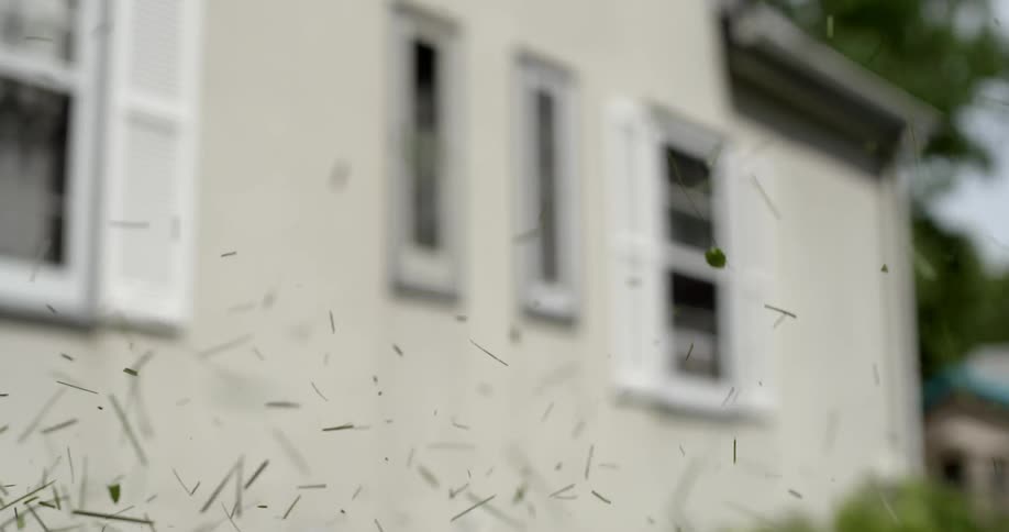 Grass is cut and flies in the air