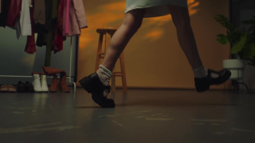 A person wearing high heels in a room