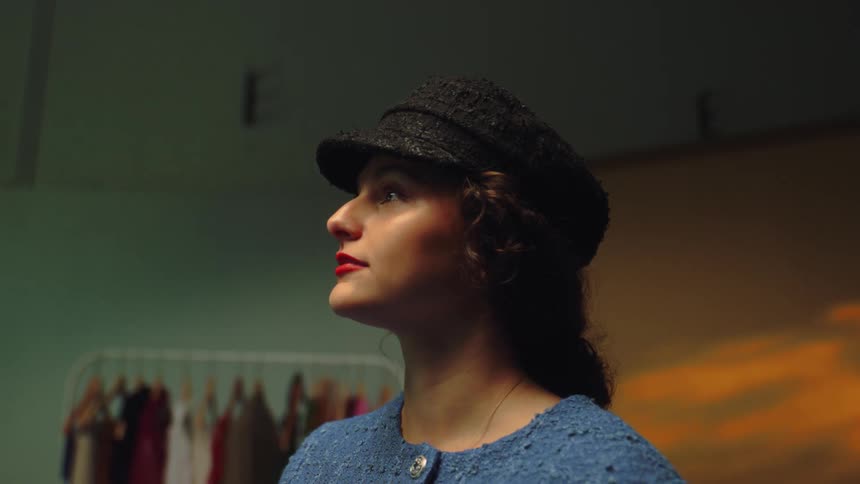 Woman tries a fancy hat