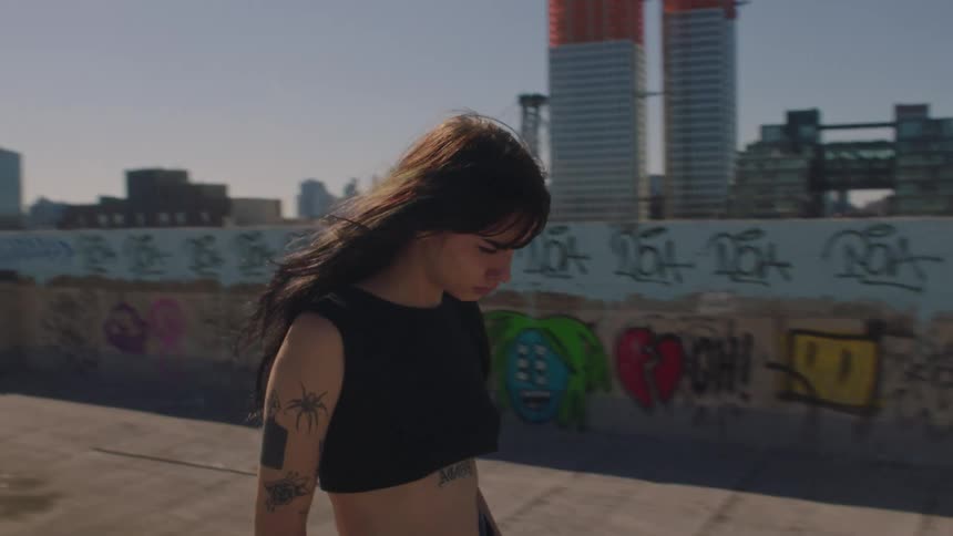 A female walking on the roof of a building