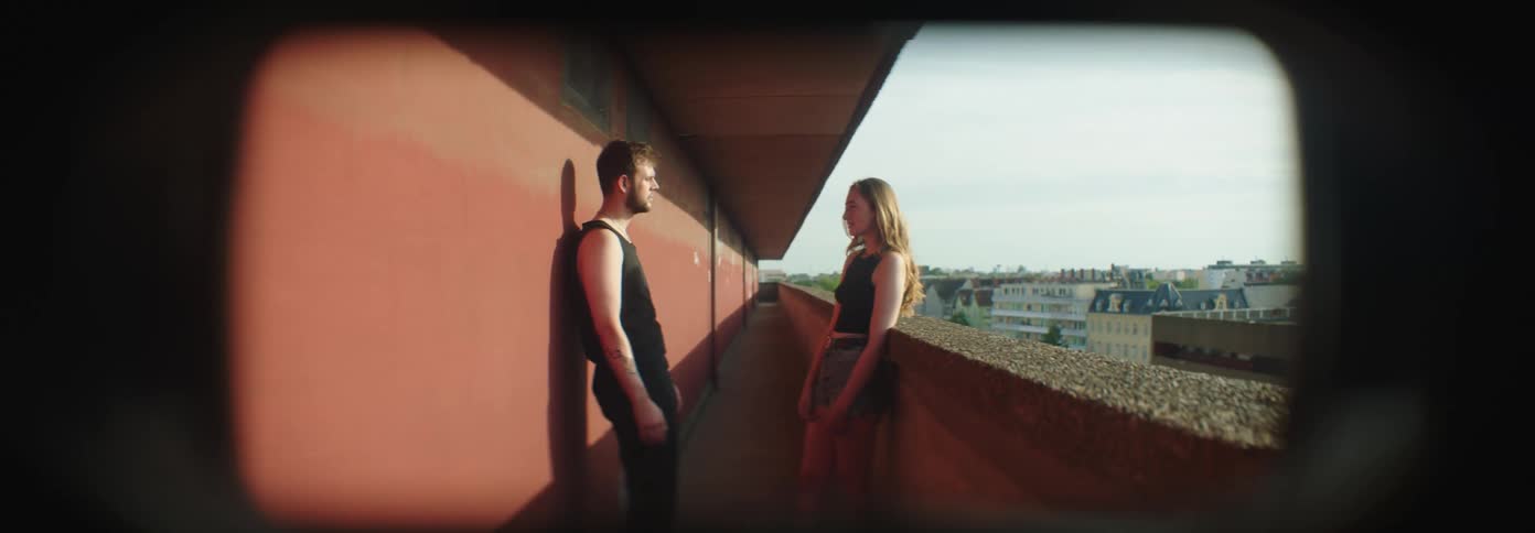 Couple in a corridor talking face to face