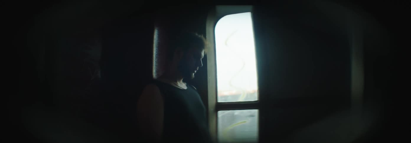 A thoughtful man in a semidark room