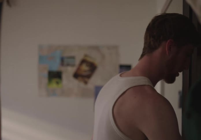 A man walks over to the closet