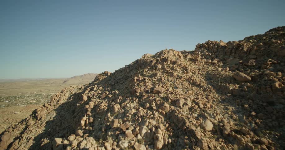 Large hills of dirt are on the landscape
