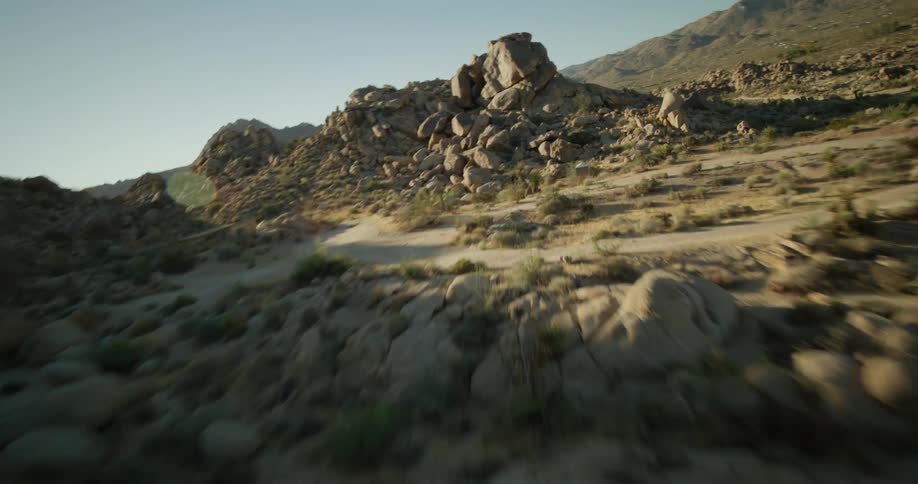 Aerial view of rocks and boulders on the slopes of a mountain in the desert
