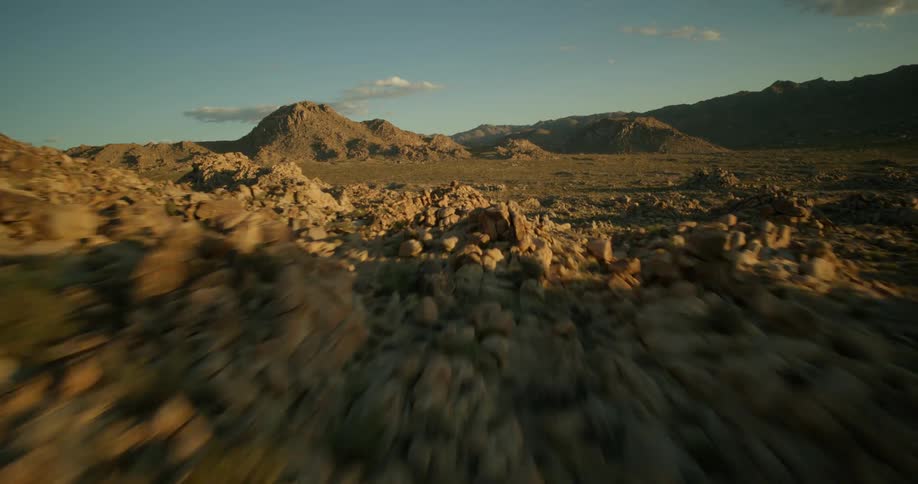 Panorama of mountains formed by stones and rocks in the light of the sunrise