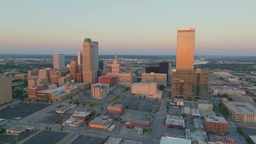 Aerial panorama of a metropolis with skyscrapers and a reddish dawn sky