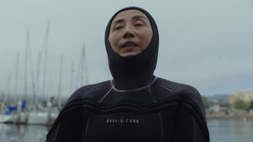 A clip of a female diver getting ready for the day