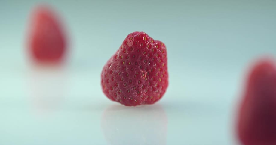 Time lapse of a still life with strawberries being frozen