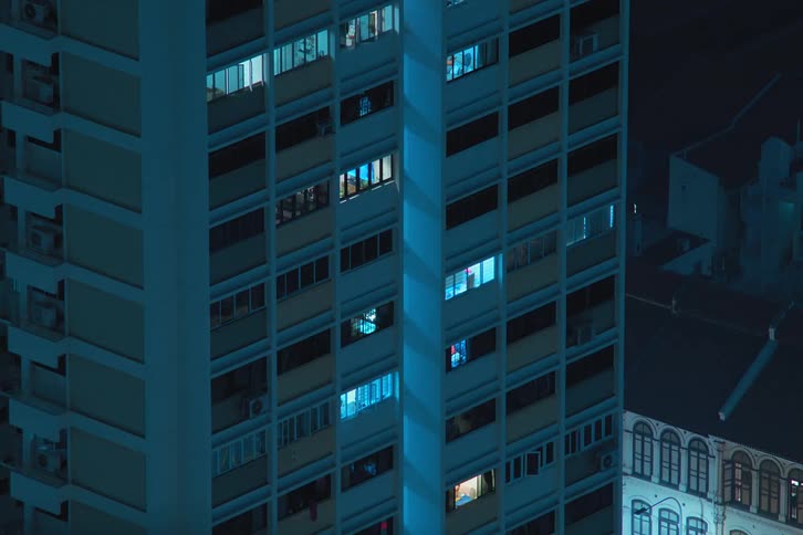 View of a residential building in a nighttime timelapse