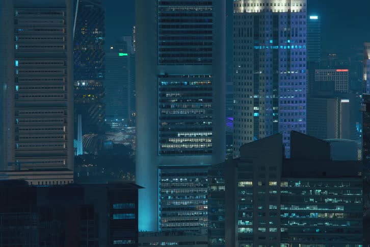 A clip of skyscrapers in a metropolis with lights turning and going off