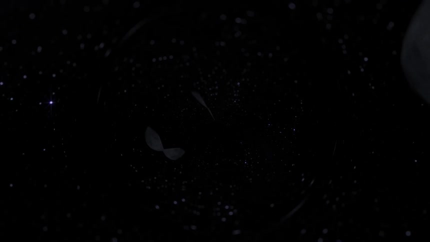 Rotating lens effect displays multiple copies of an asteroid passing through space