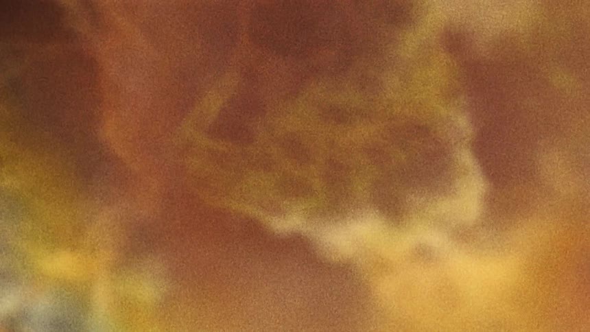 Pink and gold nebula cloud separating from the main area