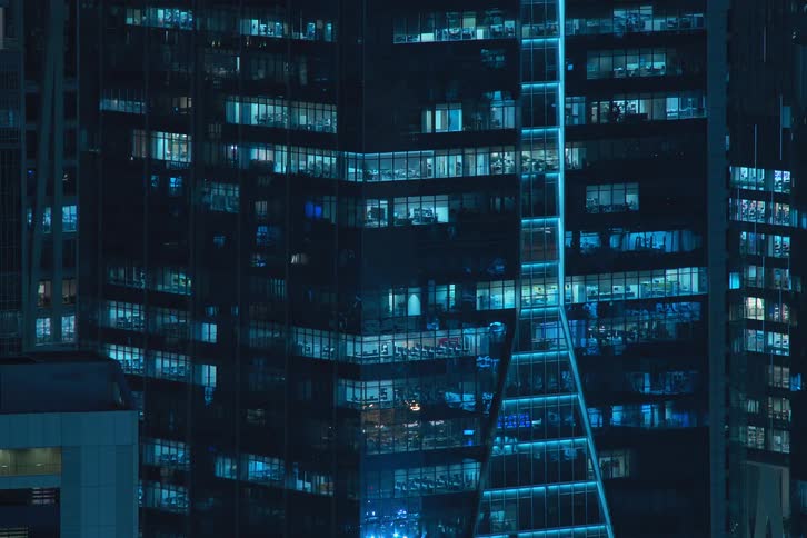 View of a skyscraper with lights turning blinking and flashing at night in timelapse