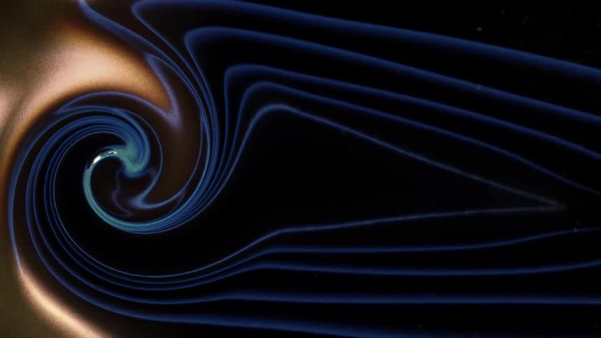 Dense blue and gold abstract swirling liquid in motion