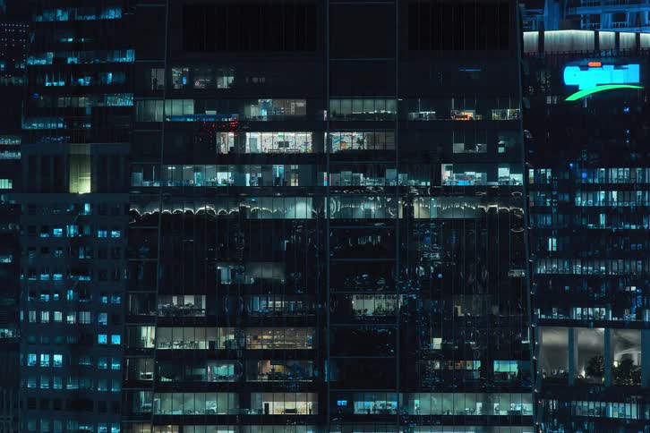 View of skyscrapers at night in time lapse