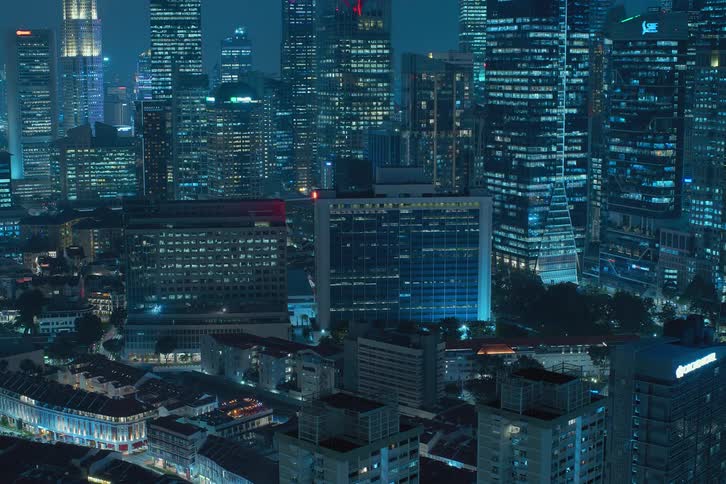 Panoramic view of buildings in a metropolis at night in time lapse