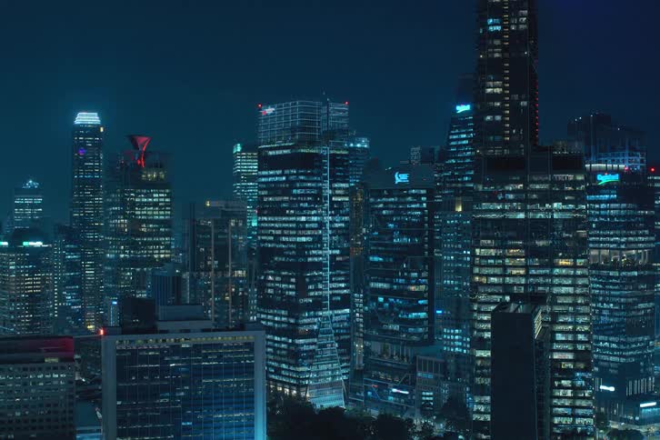 Skyscrapers with lights illuminating the city at night