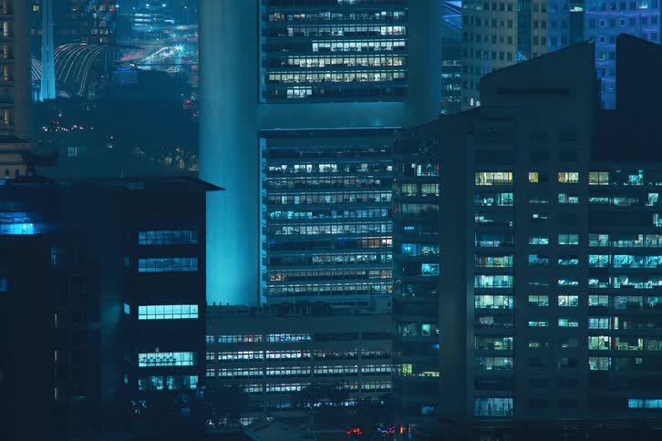 View of buildings in a metropolis at night in time lapse