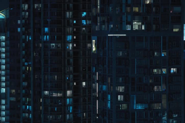 Lights in the apartments of city buildings at night