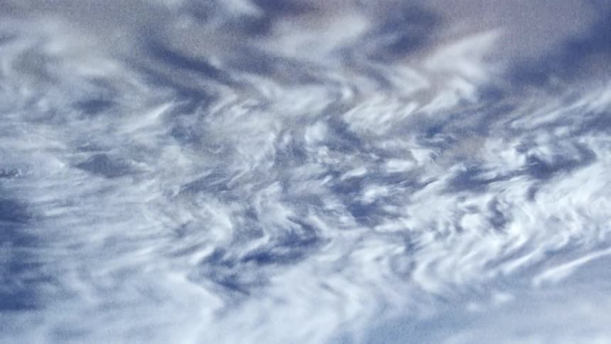 White and blue layers weave back and forth while flowing upward