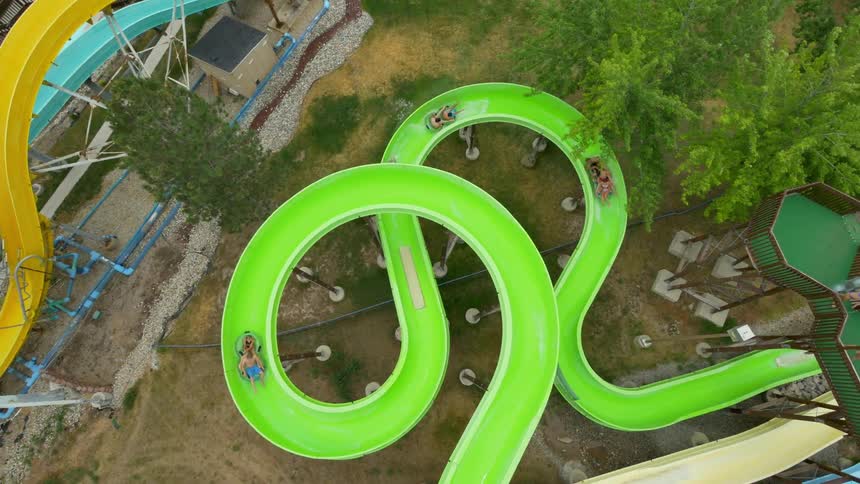People are riding slides below in a water park