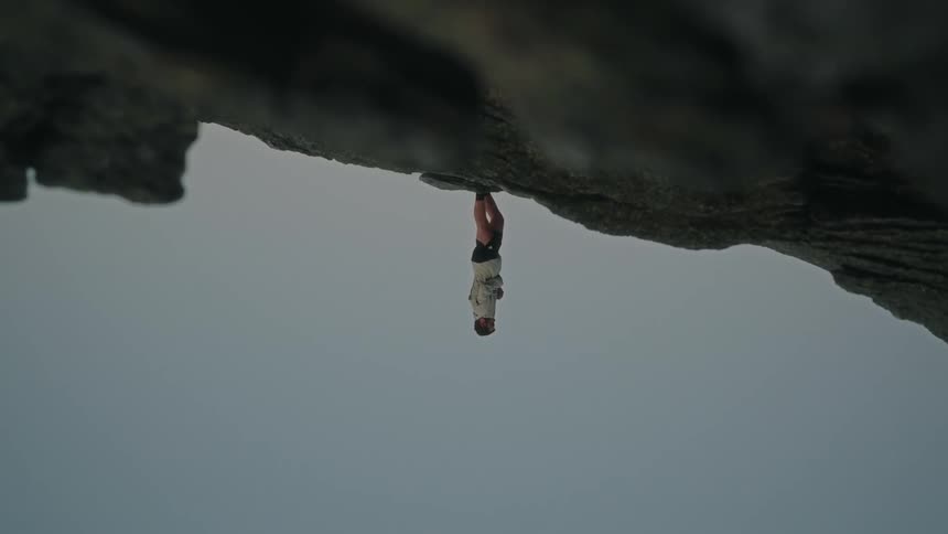 Man on a rocky ground on a cloudy day