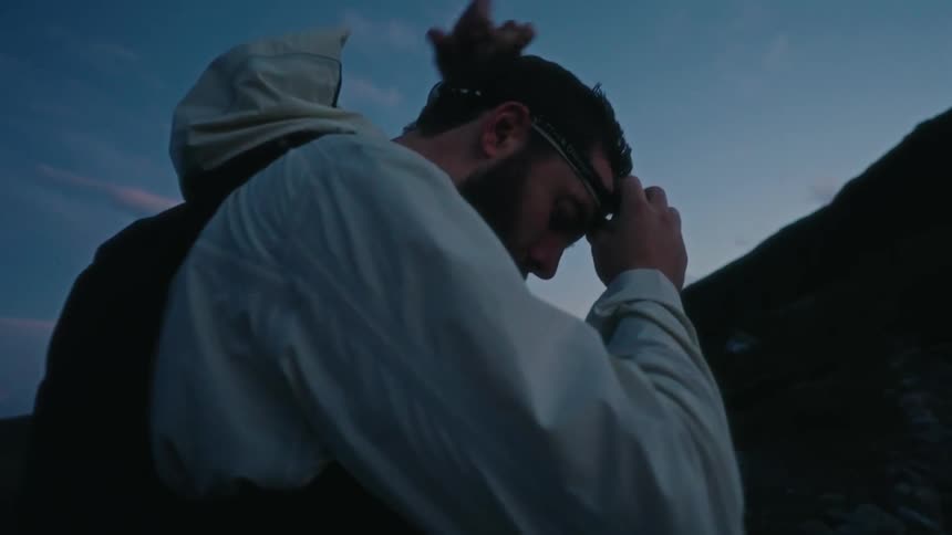 A man putting on his head lamp