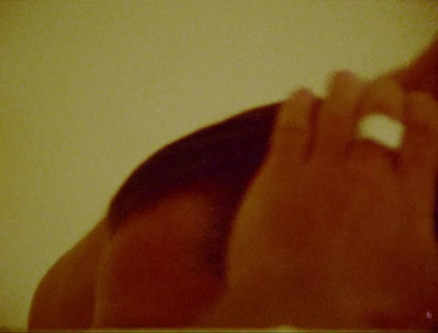 Closeup of a man combing his hair with a comb