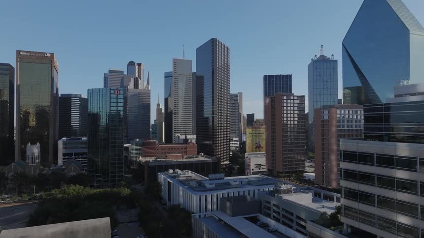 Aerial of skyscrapers in a downtown urban area on sunny summer day
