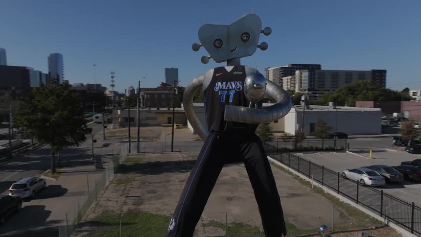 Aerial view of the traveling man sculpture in dallas