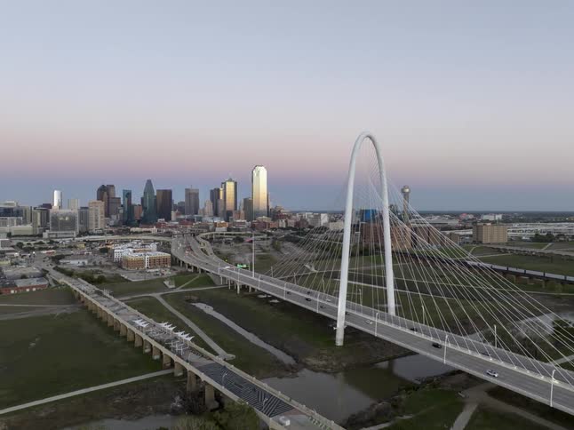 Aerial of bridge and downtown dallas skyline at sunrise