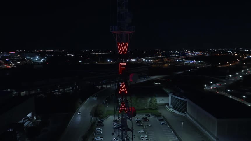 Aerial view of illuminated hotel and cityscape